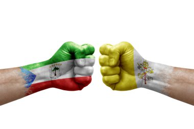 Two hands punch to each others on white background. Country flags painted fists, conflict crisis concept between equatorial guinea and holy see