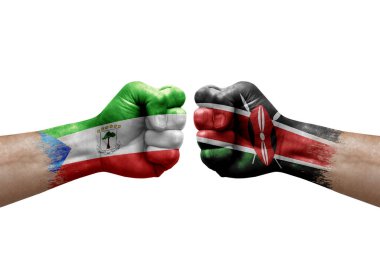 Two hands punch to each others on white background. Country flags painted fists, conflict crisis concept between equatorial guinea and kenya