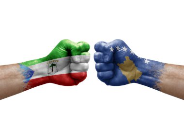 Two hands punch to each others on white background. Country flags painted fists, conflict crisis concept between equatorial guinea and kosovo