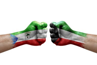 Two hands punch to each others on white background. Country flags painted fists, conflict crisis concept between equatorial guinea and kuwait