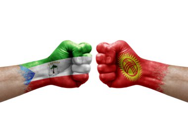 Two hands punch to each others on white background. Country flags painted fists, conflict crisis concept between equatorial guinea and kyrgyzstan