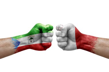 Two hands punch to each others on white background. Country flags painted fists, conflict crisis concept between equatorial guinea and malta