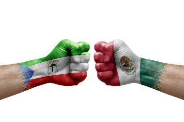 Two hands punch to each others on white background. Country flags painted fists, conflict crisis concept between equatorial guinea and mexico