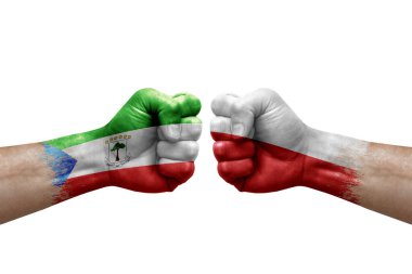 Two hands punch to each others on white background. Country flags painted fists, conflict crisis concept between equatorial guinea and poland