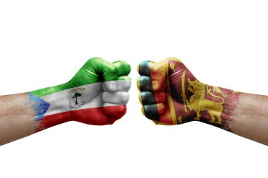 Two hands punch to each others on white background. Country flags painted fists, conflict crisis concept between equatorial guinea and sri lanka
