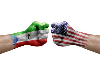 Two hands punch to each others on white background. Country flags painted fists, conflict crisis concept between equatorial guinea and usa