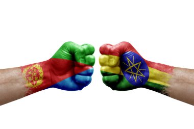 Two hands punch to each others on white background. Country flags painted fists, conflict crisis concept between eritrea and ethiopia