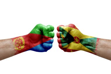 Two hands punch to each others on white background. Country flags painted fists, conflict crisis concept between eritrea and grenada