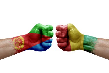 Two hands punch to each others on white background. Country flags painted fists, conflict crisis concept between eritrea and guinea