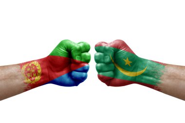 Two hands punch to each others on white background. Country flags painted fists, conflict crisis concept between eritrea and mauritania