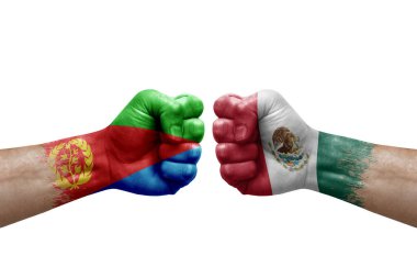 Two hands punch to each others on white background. Country flags painted fists, conflict crisis concept between eritrea and mexico