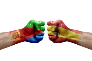 Two hands punch to each others on white background. Country flags painted fists, conflict crisis concept between eritrea and spain