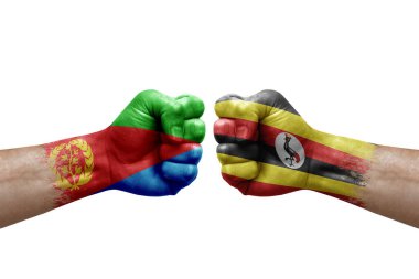 Two hands punch to each others on white background. Country flags painted fists, conflict crisis concept between eritrea and uganda