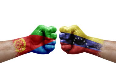 Two hands punch to each others on white background. Country flags painted fists, conflict crisis concept between eritrea and venezuela