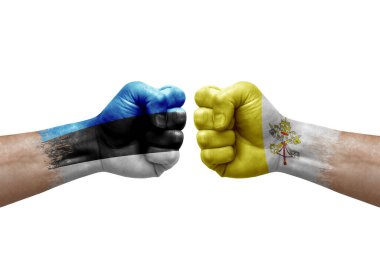 Two hands punch to each others on white background. Country flags painted fists, conflict crisis concept between estonia and holy see