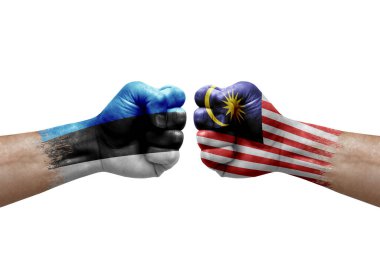 Two hands punch to each others on white background. Country flags painted fists, conflict crisis concept between estonia and malaysia