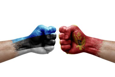 Two hands punch to each others on white background. Country flags painted fists, conflict crisis concept between estonia and montenegro