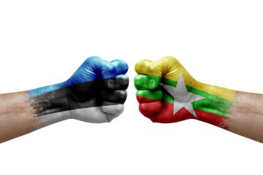 Two hands punch to each others on white background. Country flags painted fists, conflict crisis concept between estonia and myanmar