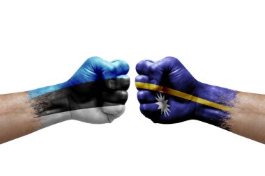Two hands punch to each others on white background. Country flags painted fists, conflict crisis concept between estonia and nauru