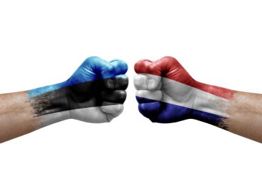 Two hands punch to each others on white background. Country flags painted fists, conflict crisis concept between estonia and netherlands