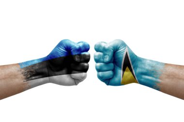 Two hands punch to each others on white background. Country flags painted fists, conflict crisis concept between estonia and saint lucia