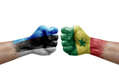 Two hands punch to each others on white background. Country flags painted fists, conflict crisis concept between estonia and senegal