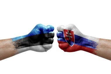 Two hands punch to each others on white background. Country flags painted fists, conflict crisis concept between estonia and slovakia