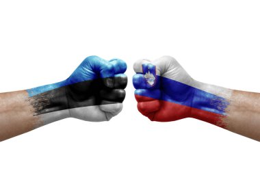 Two hands punch to each others on white background. Country flags painted fists, conflict crisis concept between estonia and slovenia