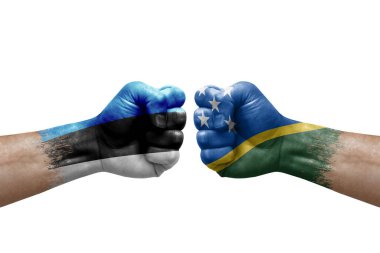 Two hands punch to each others on white background. Country flags painted fists, conflict crisis concept between estonia and solomon islands