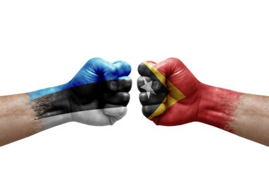 Two hands punch to each others on white background. Country flags painted fists, conflict crisis concept between estonia and timor leste