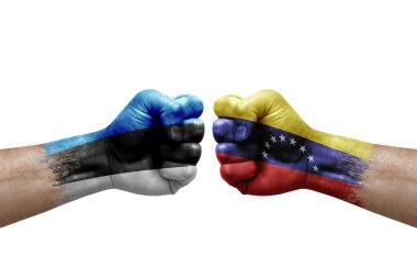 Two hands punch to each others on white background. Country flags painted fists, conflict crisis concept between estonia and venezuela