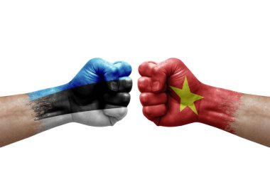 Two hands punch to each others on white background. Country flags painted fists, conflict crisis concept between estonia and vietnam