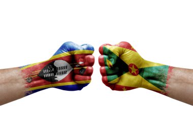 Two hands punch to each others on white background. Country flags painted fists, conflict crisis concept between eswatini and grenada