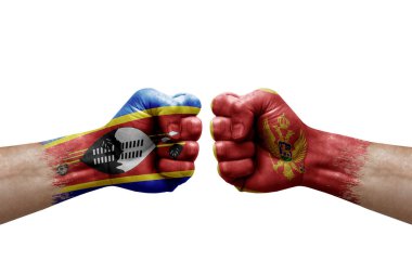 Two hands punch to each others on white background. Country flags painted fists, conflict crisis concept between eswatini and montenegro