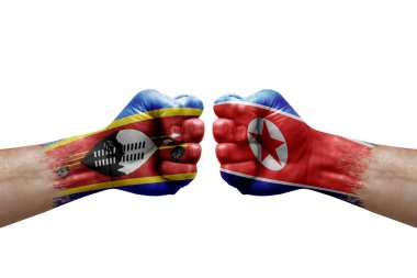 Two hands punch to each others on white background. Country flags painted fists, conflict crisis concept between eswatini and north korea