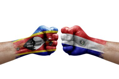 Two hands punch to each others on white background. Country flags painted fists, conflict crisis concept between eswatini and paraguay