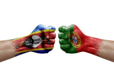 Two hands punch to each others on white background. Country flags painted fists, conflict crisis concept between eswatini and portugal