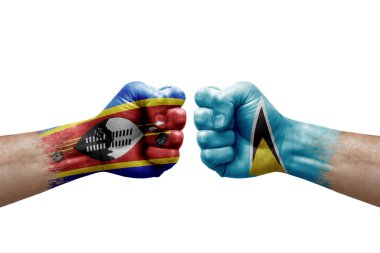 Two hands punch to each others on white background. Country flags painted fists, conflict crisis concept between eswatini and saint lucia