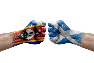 Two hands punch to each others on white background. Country flags painted fists, conflict crisis concept between eswatini and scotland