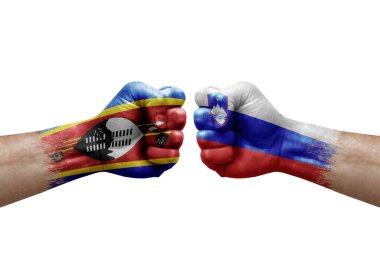 Two hands punch to each others on white background. Country flags painted fists, conflict crisis concept between eswatini and slovenia