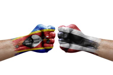 Two hands punch to each others on white background. Country flags painted fists, conflict crisis concept between eswatini and thailand