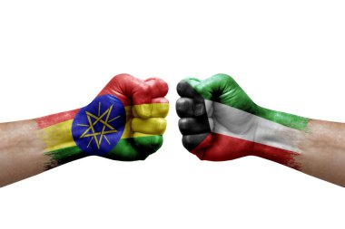 Two hands punch to each others on white background. Country flags painted fists, conflict crisis concept between ethiopia and kuwait