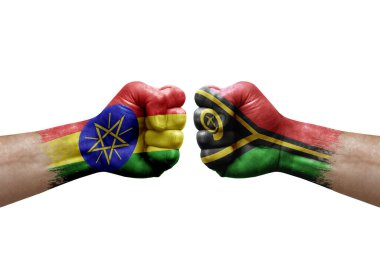 Two hands punch to each others on white background. Country flags painted fists, conflict crisis concept between ethiopia and vanuatu