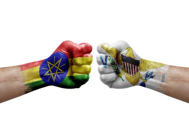 Two hands punch to each others on white background. Country flags painted fists, conflict crisis concept between ethiopia and virgin islands