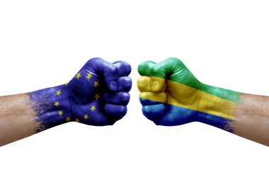 Two hands punch to each others on white background. Country flags painted fists, conflict crisis concept between european union and gabon