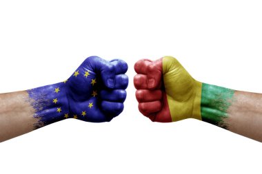 Two hands punch to each others on white background. Country flags painted fists, conflict crisis concept between european union and guinea