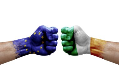 Two hands punch to each others on white background. Country flags painted fists, conflict crisis concept between european union and ireland