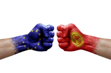 Two hands punch to each others on white background. Country flags painted fists, conflict crisis concept between european union and kyrgyzstan
