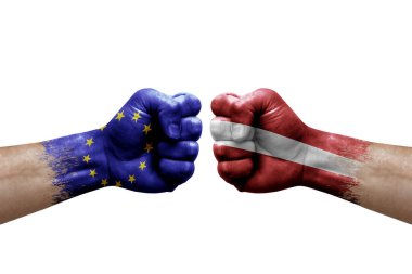 Two hands punch to each others on white background. Country flags painted fists, conflict crisis concept between european union and latvia