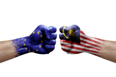 Two hands punch to each others on white background. Country flags painted fists, conflict crisis concept between european union and malaysia